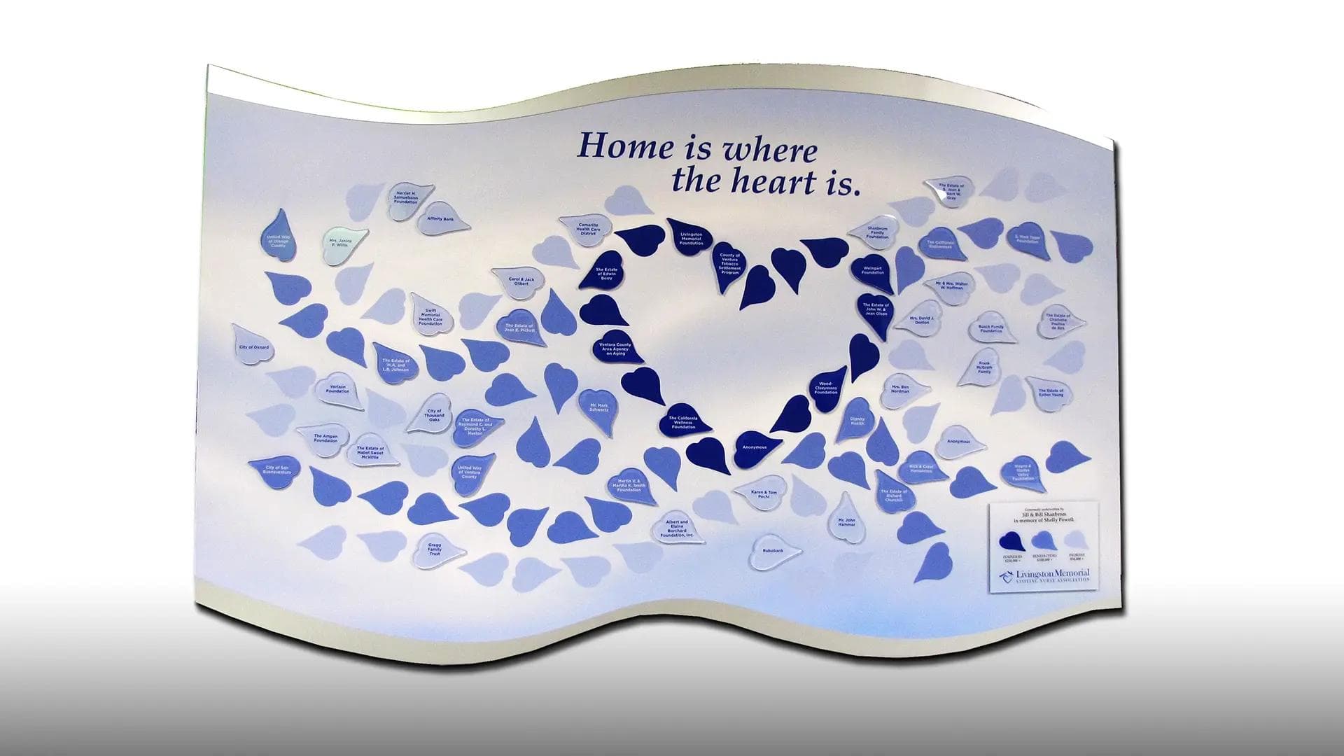 Livingston Memorial Hospice tile donor wall with heart-shaped donor tiles forming a flowing, sculptural design.