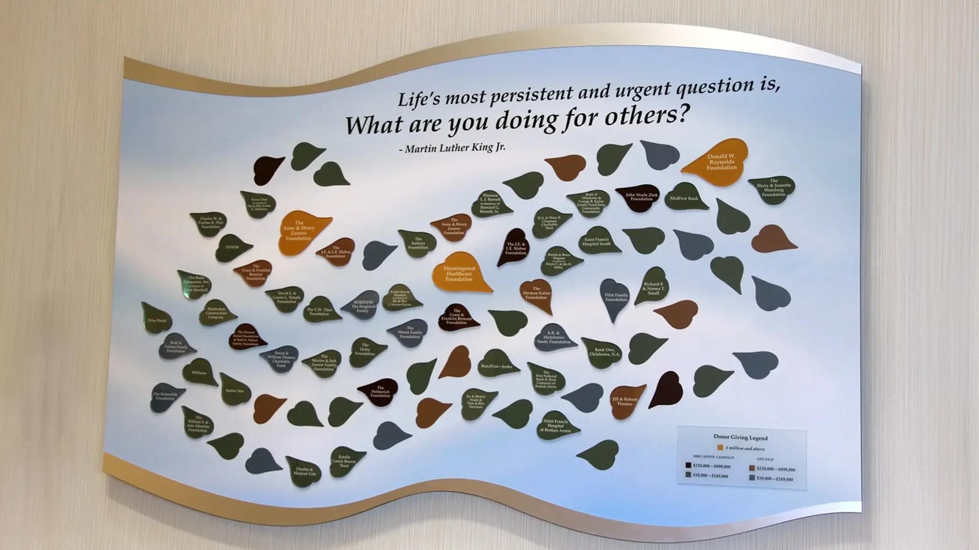 Senior living tile donor wall featuring leaf-shaped donor tiles and an inspirational quote by Martin Luther King Jr.